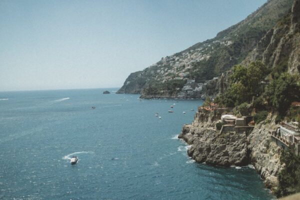 The Amalfi Coast in Italy, cliffside villages above a blue Mediterranean sea